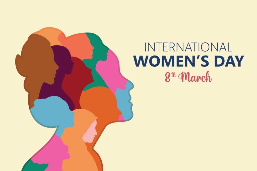 A graphic of a woman's head and torso. The woman is facing the right hand side and the image is made up of lots of overlapping women's faces in different colours. The graphic background is cream and the heading "International Women's Day 8th March" is in the top right.