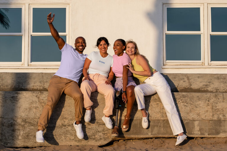 Four friends enjoying the sun during summer.